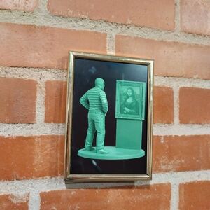 Burglar With Mona Lisa Plastic Army Man Framed Art Print By Neon Nicho